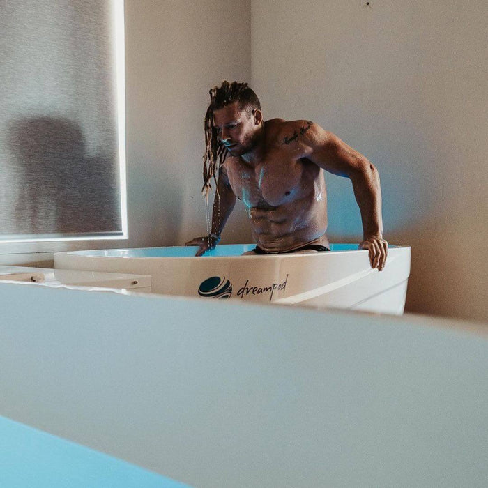 Male athlete enjoying an ice bath