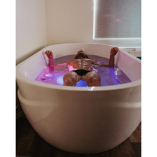 A man taking an ice bath